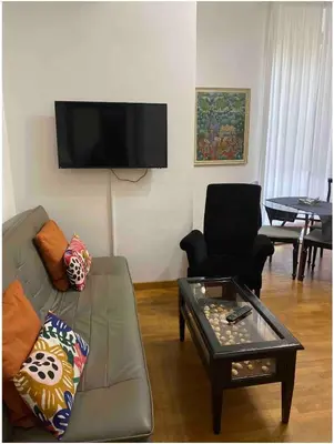 a living room with a couch and a coffee table at IN FRONT OF COLISEUM 3 in Rome