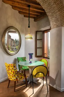 a dining room with a table and chairs at Palm Suites - Small Luxury Hotels of the World in Rome
