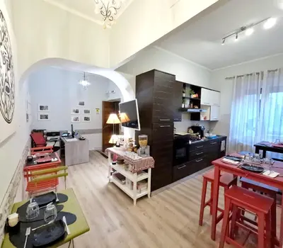 a living room with a kitchen and a dining room at Vatican Luxury Corner in Rome