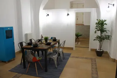 a dining room with a table and chairs at Exclusive Central Apartment 48 in Rome