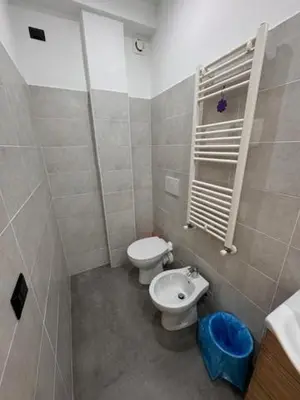 a small bathroom with a toilet and a sink at Alloggio Roma Appia in Rome