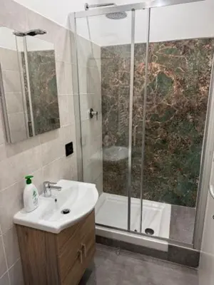 a bathroom with a shower and a sink at Alloggio Roma Appia in Rome