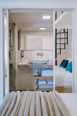 a bathroom with a sink and a bed at Navona Style in Rome