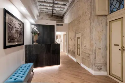 a hallway with a blue bench in a room at Navona Style in Rome