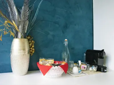 a table with a vase and a basket of food at B&B Dea Tiburtina in Rome