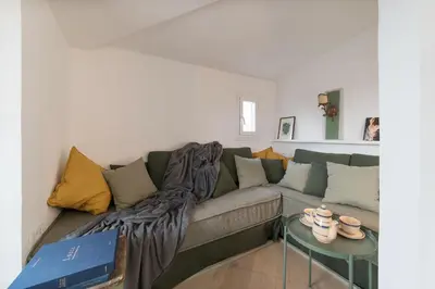 a living room with a couch and a table at GuestHost - Piazza Venezia&Colosseum Loft in Rome