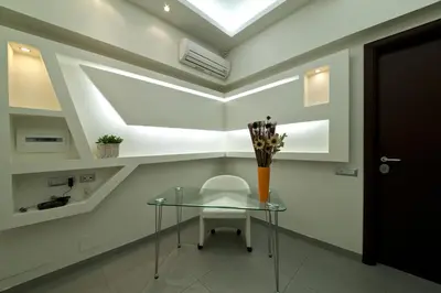 a glass table with a vase on it in a room at Roma Naif Rooms in Rome