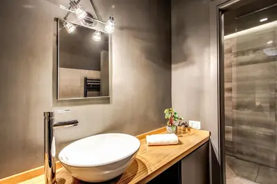 a bathroom with a white sink and a mirror at 11 Via di Sant'Eligio in Rome