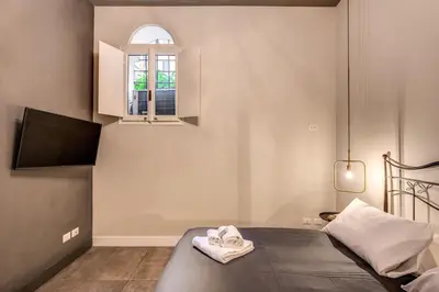 a bedroom with a bed and a window at 11 Via di Sant'Eligio in Rome