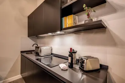 a kitchen with a counter top with a toaster and a toaster at 11 Via di Sant'Eligio in Rome