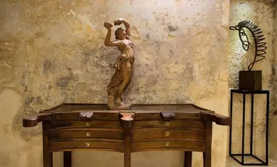 a room with a bed and a table and chairs at Hotel La Rovere in Rome