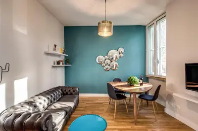 a living room with a couch and a table at Sant'Eligio 2BDR in Rome