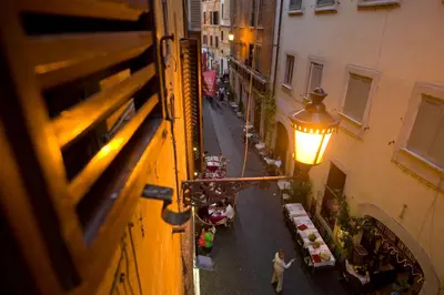 an overhead view of a street with tables and a lamp at POP Art B&B in Rome