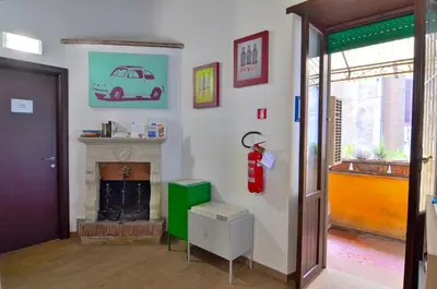 a living room with a fireplace and a fire place at POP Art B&B in Rome