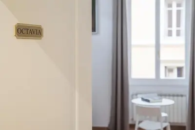 a door with a sign that reads oatalia on it at Appartamento Via Genova in Rome
