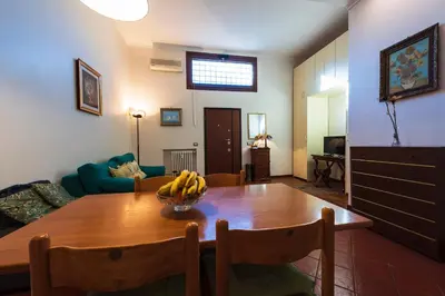 a living room with a wooden table with bananas on it at Toberto Apartment in Rome