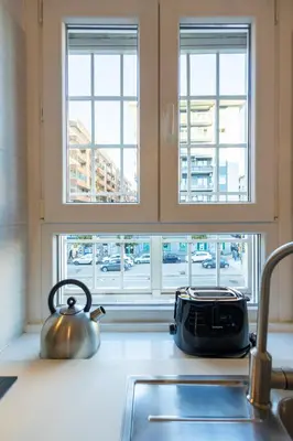 a tea kettle on a kitchen counter next to a window at Ottoboni Apartment, 4 persone, balcone, Wi-Fi, Stazione Tiburtina in Rome