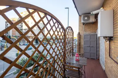 a balcony with a table and chairs on a balcony at Ottoboni Apartment, 4 persone, balcone, Wi-Fi, Stazione Tiburtina in Rome