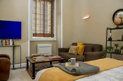 a living room with a couch and a tv at Marvellous apt near Vatican in Rome