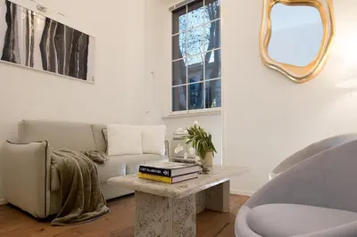 a living room with a couch and a table at Marvellous apt near Vatican in Rome