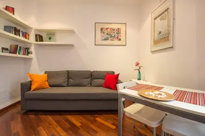 a living room with a couch and a table at Annalisa Apartment in Rome