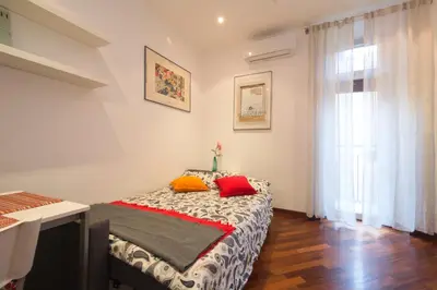 a bedroom with a bed with two pillows on it at Annalisa Apartment in Rome