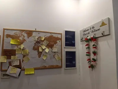 a bulletin board with a map of the world with christmas tags at Oasi Del Vaticano in Rome