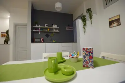 a kitchen with two green plates on a table at Oasi Del Vaticano in Rome
