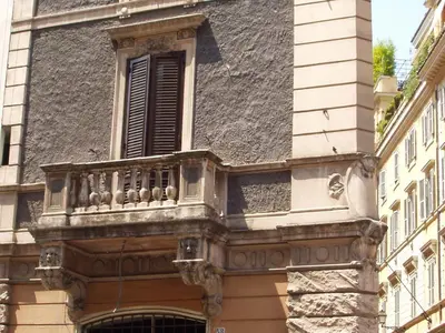 a balcony on the side of a building with a window at GREGORIANA HOUSE - Appartamento con Vista su Roma in Rome