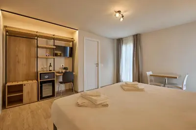 a bedroom with a bed with two towels on it at Relais Tiburtina in Rome