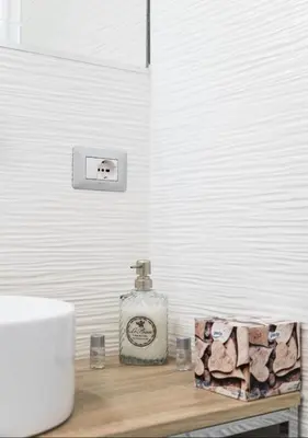 a bathroom with a sink and a soap dispenser on a counter at Casette Romane 