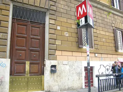 a mcdonalds sign on the side of a building at Bless&B G.H. in Rome