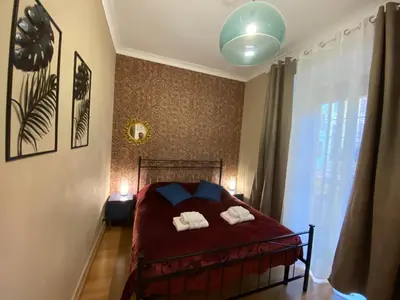 a bedroom with a bed with two towels on it at GuestART Monti Apartment in Rome