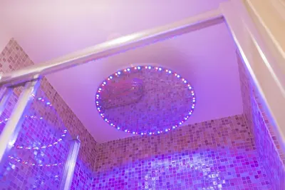 a bathroom with purple lights on the ceiling at Pantheon Romantic Loft in Rome
