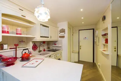 a kitchen with a white counter top in a room at Pantheon Romantic Loft in Rome