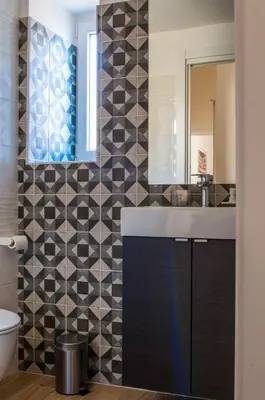 a bathroom with a sink and a mirror at St. Peter Vatican Apartment in Rome