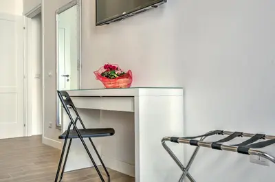 a room with a table and a basket of flowers at St. Peter Vatican Apartment in Rome