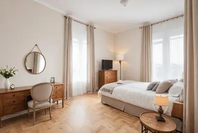 a bedroom with a bed and a desk and a mirror at Carducci Luxury Apartment in Rome