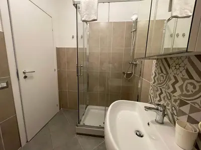 a bathroom with a sink and a shower at Luciano Licia Guest House in Rome