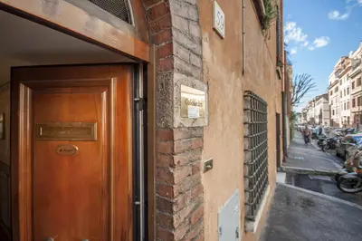 a wooden door on the side of a brick building at Colosseum B in Rome