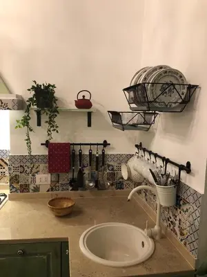 a kitchen counter with a sink and a mixer at 