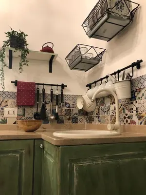 a kitchen with a sink and utensils on the wall at 