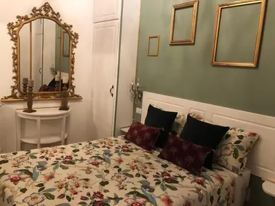 a bedroom with a bed and a mirror at 