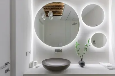a bathroom with a black sink and a mirror at iFlat Vatican High-End Apartment in Rome