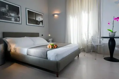a bedroom with a bed with a bowl of fruit on it at B&B Best Vatican in Rome