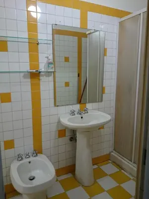 a bathroom with a sink and a mirror at Pimpinella in Rome
