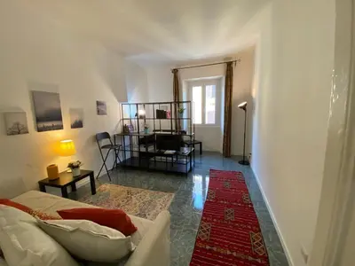 a living room with a couch and a table at Pimpinella in Rome