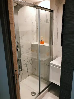 a shower with a glass door in a bathroom at Spagna Gregoriana 46 in Rome