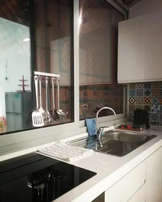 a kitchen with a sink and a counter top at Spagna Gregoriana 46 in Rome