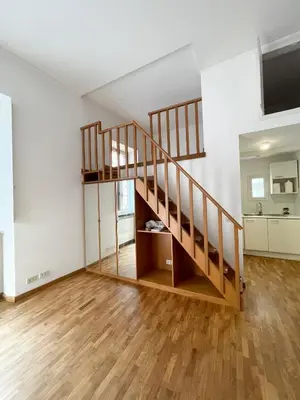 an empty room with a staircase in a house at La Pigna Boutique Apartment in Rome